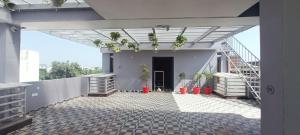 a balcony of a building with plants on it at Hotel Royal Casa in Lucknow