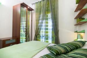 a bedroom with a bed with a window and a bed sidx sidx sidx at Borgo Caere in Ladispoli +17 photos