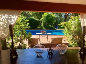 a table with three glass bowls on top of it at Borgo Caere in Ladispoli
