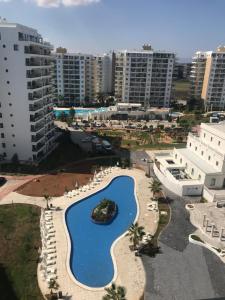 an aerial view of a swimming pool in a city at Studio Alev POOLview-CaesarResortSpa(North Cyprus) in Perivolia tou Trikomou