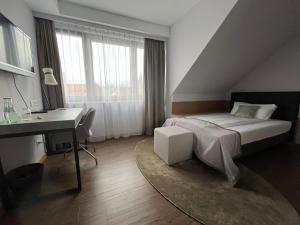 Postel nebo postele na pokoji v ubytování Hotel am Markt