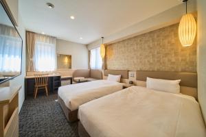 Voodi või voodid majutusasutuse Via inn Kyoto Shijomuromachi toas