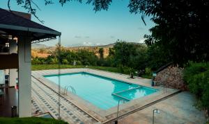 La pileta dentro o cerca de Commune18 Resort Chikmagalur