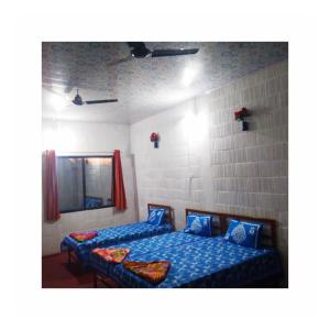 Jungleview Mudumalai tesisinde bir odada yatak veya yataklar