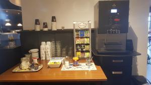 a kitchen with a counter with a coffee maker at City Hotel Winschoten in Winschoten