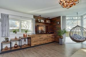 Posezení v ubytování Adler Chalet in Längenfeld