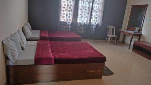 Katil atau katil-katil dalam bilik di MYSORE MAHALAKSHMI ROOMS