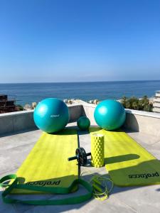 a group of snowboards and exercise equipment on a roof at Aria Riva Apart Hotel in Alanya