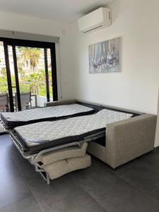 a bed frame in a room with at Miami Beach Puerto Rico in Mogán