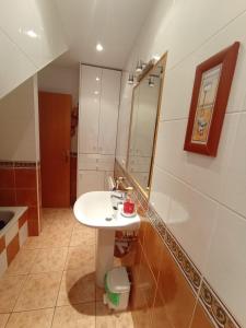 a bathroom with a sink and a mirror at casa rural El Burrillo in Cuenca