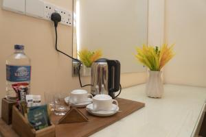 Příslušenství pro přípravu čaje a kávy v ubytování Nilawin Hotels & Resorts