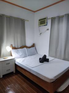 Postel nebo postele na pokoji v ubytování Hidden Gem Siargao