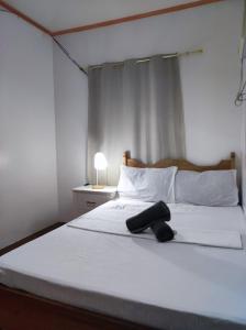 Postel nebo postele na pokoji v ubytování Hidden Gem Siargao