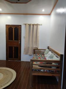 Postel nebo postele na pokoji v ubytování Hidden Gem Siargao