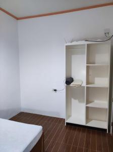 Postel nebo postele na pokoji v ubytování Hidden Gem Siargao