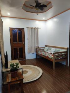 Postel nebo postele na pokoji v ubytování Hidden Gem Siargao