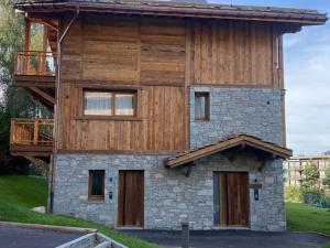 a house with a balcony on top of it at Chalet Courchevel, 6 pièces, 10 personnes - FR-1-568-27 in Courchevel