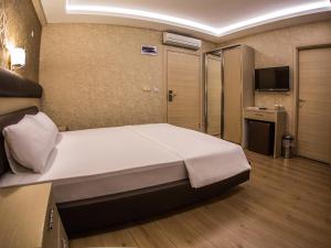 Postel nebo postele na pokoji v ubytování Payidar Hotel