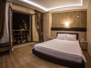 Postel nebo postele na pokoji v ubytování Payidar Hotel