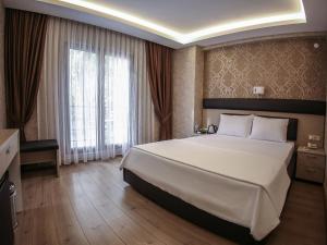 Postel nebo postele na pokoji v ubytování Payidar Hotel