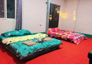 Postel nebo postele na pokoji v ubytování Pamaew Homestay ป้าแมว โฮมสเตย์