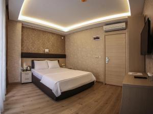 Postel nebo postele na pokoji v ubytování Payidar Hotel