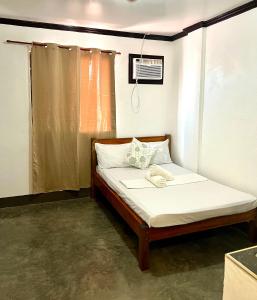 Postel nebo postele na pokoji v ubytování Hidden Gem Siargao