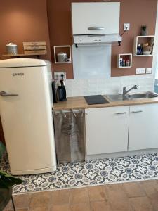 Kuchyň nebo kuchyňský kout v ubytování Appartement coeur de ville -Clim, ascenseur, wifi-