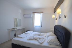 Postel nebo postele na pokoji v ubytování Smart City Bodrum Hotel