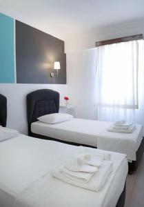 Postel nebo postele na pokoji v ubytování Smart City Bodrum Hotel