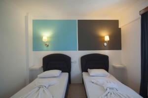 Postel nebo postele na pokoji v ubytování Smart City Bodrum Hotel