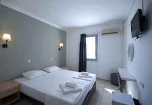 Postel nebo postele na pokoji v ubytování Smart City Bodrum Hotel