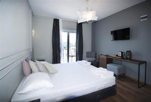 Postel nebo postele na pokoji v ubytování Smart City Bodrum Hotel