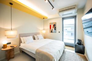 Ein Bett oder Betten in einem Zimmer der Unterkunft Design Rooms - Kvaternik Square