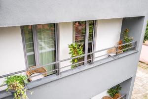 Ein Balkon oder eine Terrasse in der Unterkunft Design Rooms - Kvaternik Square