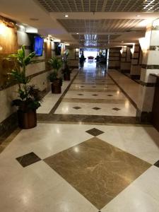 a lobby of a building with a tile floor at جوار البيت مكة in Makkah