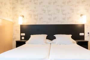 Cama ou camas em um quarto em Hotel Don Diego