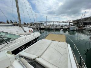 a boat docked in a marina with other boats at Barco acogedor - Cosy Boat - Barcelona in Barcelona