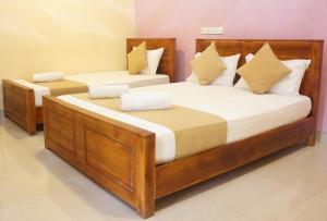 Ένα ή περισσότερα κρεβάτια σε δωμάτιο στο Araliya