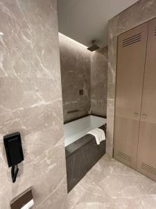 a bathroom with a bath tub and a sink at Best opportunity in emaar in Istanbul