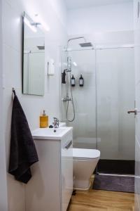 a bathroom with a sink and a shower at Triana Riverside in Seville