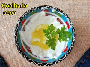 a bowl of yogurt with parsley on a table at Vila Santa Rosa in Ilhabela