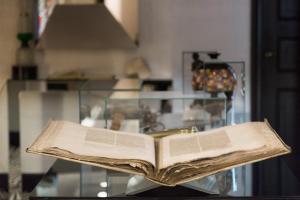 an open book sitting on top of a glass table at Hotel Punta Tragara in Capri