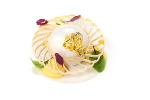 a ring with a pearl and diamonds on a white background at Hotel Punta Tragara in Capri