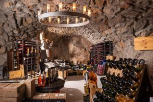 a wine tasting room with a bunch of wine bottles at Hotel Punta Tragara in Capri