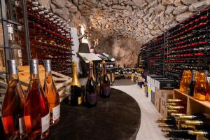 a wine store with a bunch of bottles of wine at Hotel Punta Tragara in Capri