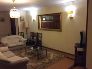 a living room with a couch and a table at Hotel O Castelo in Cervo