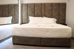 A bed or beds in a room at Mega Hostal Santa Cruz