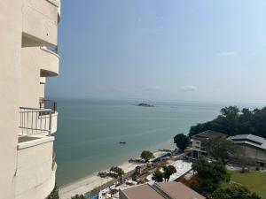 a view of the ocean from a building at Paradise by the Sea in Penang by Veron at Rainbow Paradise in Tanjung Bungah