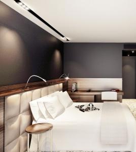 A bed or beds in a room at Howard Hotel Paris Orly Airport